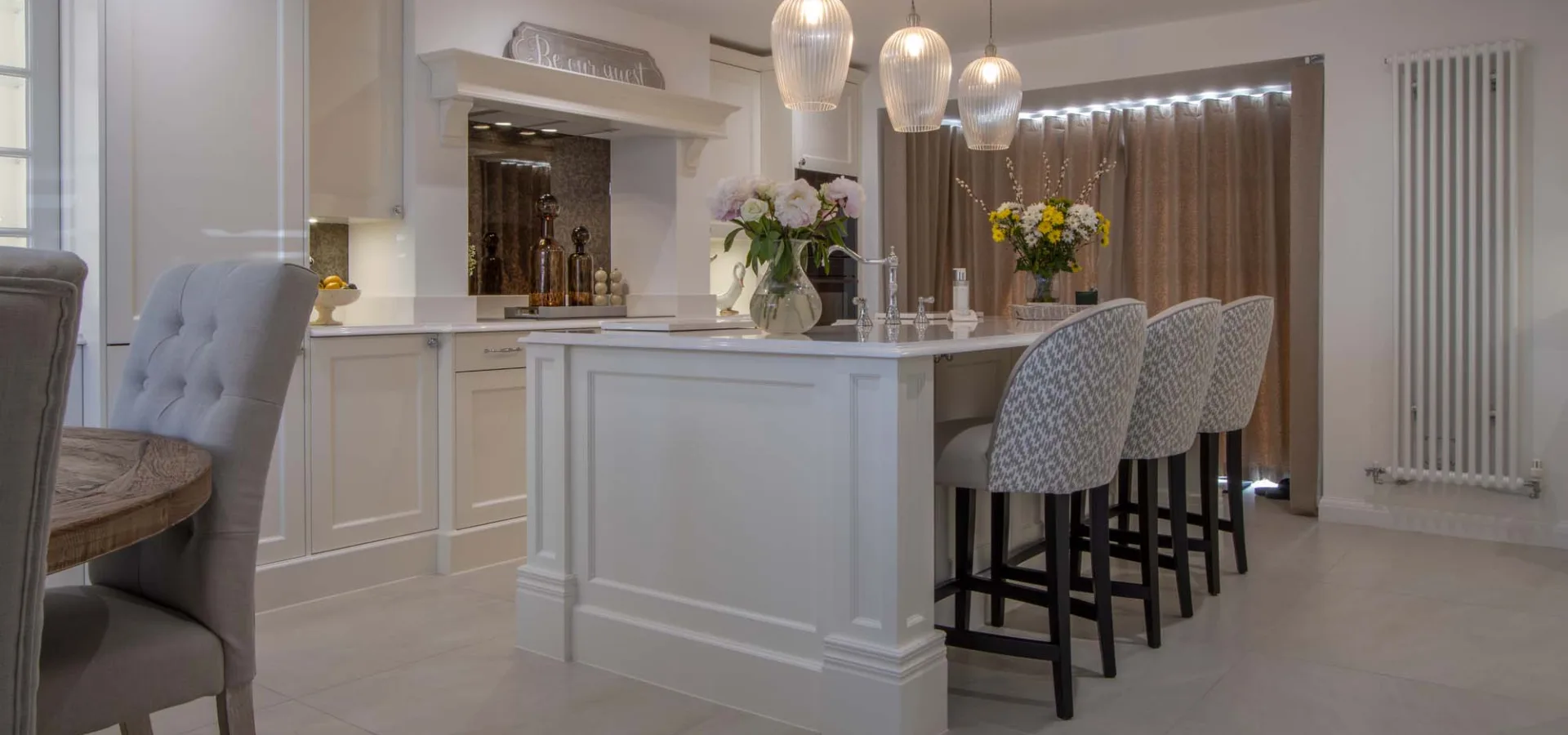 Cream classic kitchen viewed from the dining area
