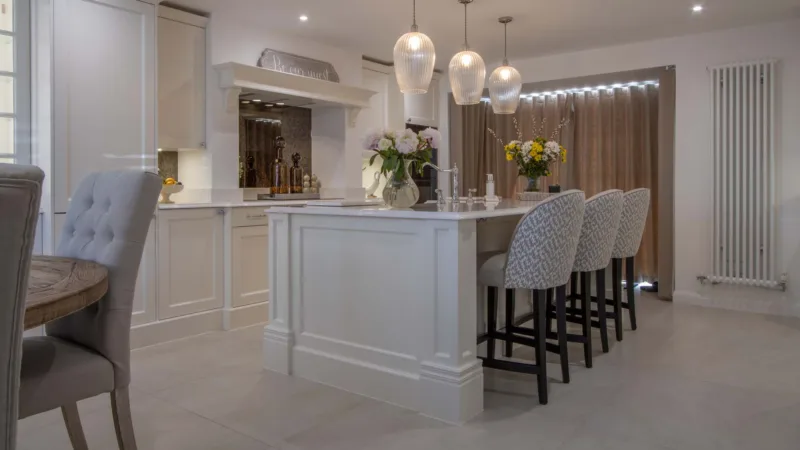 Cream classic kitchen viewed from the dining area